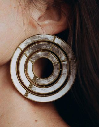 Large white circular earring