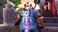 A Pandaren from World of Warcraft wearing blue and purple armor
