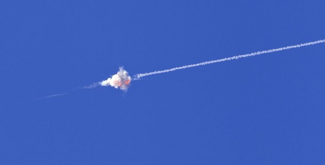 An Israeli Iron Dome interceptor blasts apart a missile fired from the Gaza Strip.