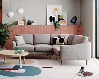 The snug Rebel corner sofa in grey upholstery in a modern living room