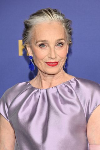 Kristin Scott Thomas is pictured wearing red lipstick and with her silver and brunette hair swept back into a take on the 'Dolce Vita Crop' hair trend at the 76th Primetime Emmy Awards held at Peacock Theater on September 15, 2024 in Los Angeles, California.