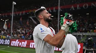 Olivier Giroud celebrates after AC Milan's win over Genoa in October 2023, which saw him end up in goal following a red card for Mike Maignan.