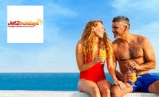 Jet 2 Holidays logo placed over an image of a couple sitting in the sun