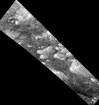 Hundreds of sand dunes can be seen as dark lines in the Shangri-La region of Saturn's moon Titan in this image from NASA's Cassini spacecraft.