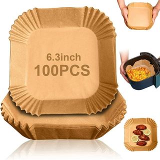 Stack of brown parchment paper air fryer liners