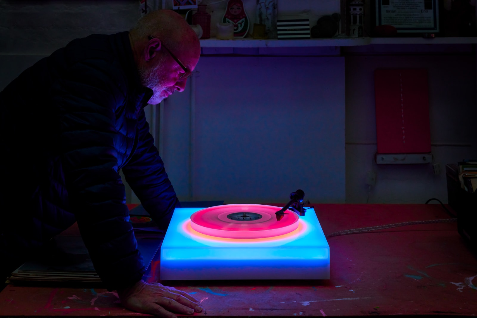 Eno stood over one of his turntables