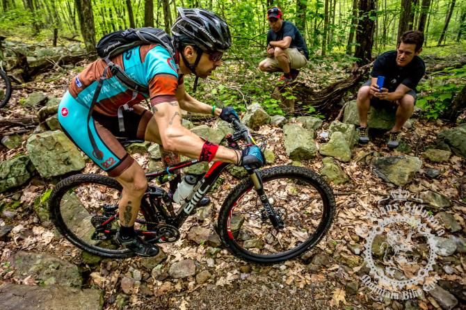 Michael Wissell carries momentum past the onlookers at the bottom of Wildcat Gap Trail.