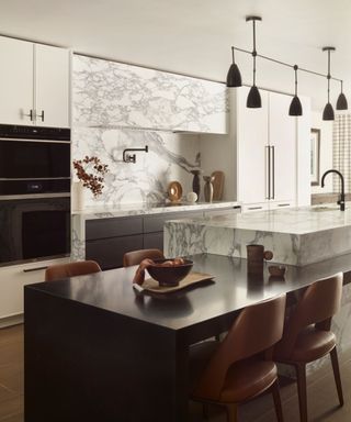 Marble kitchen with island and built-in dining table