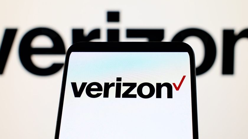 Verizon logo on a phone in front of a Verizon logo