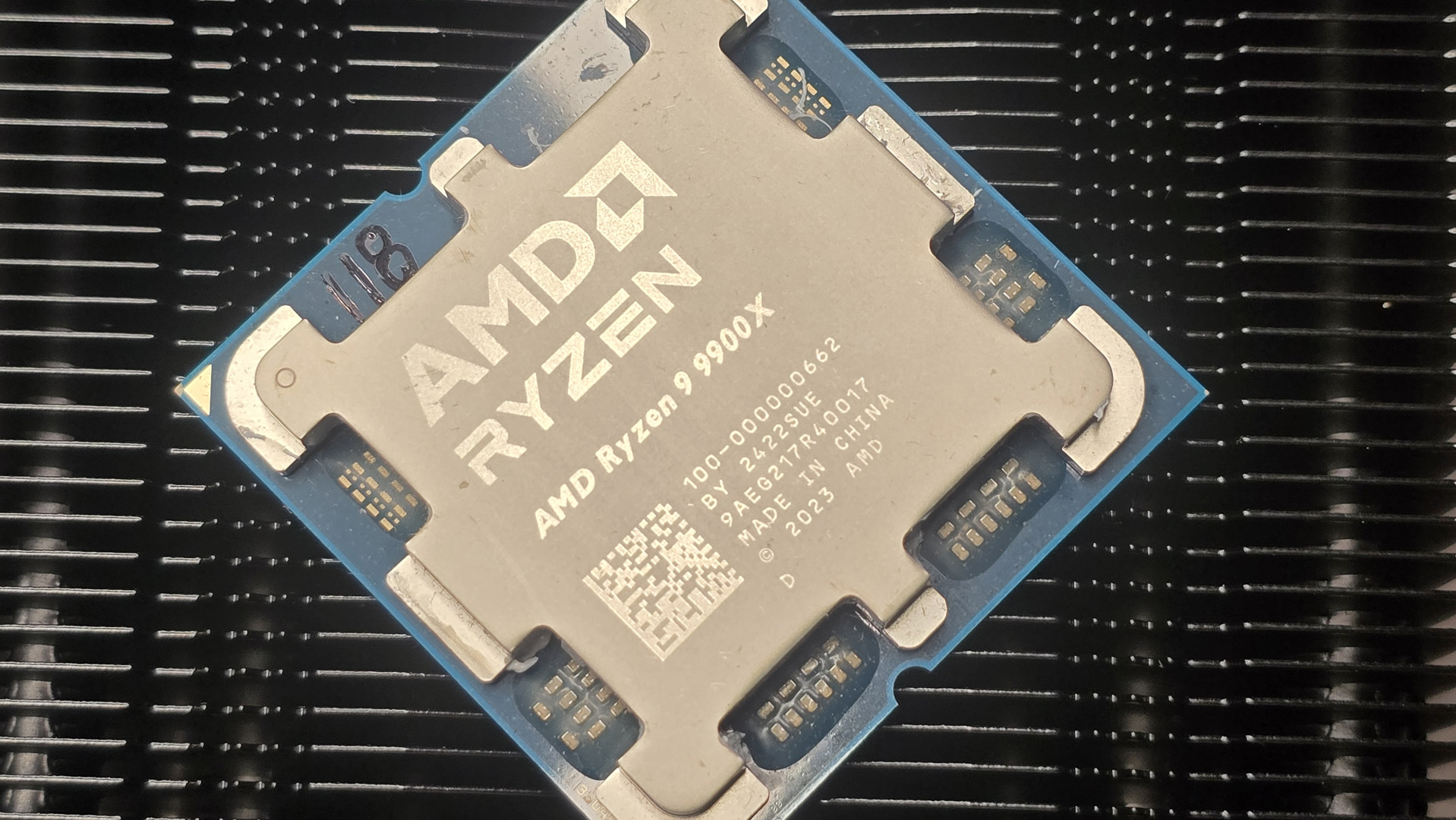 The AMD Ryzen 9 9900X CPU lying diagonally