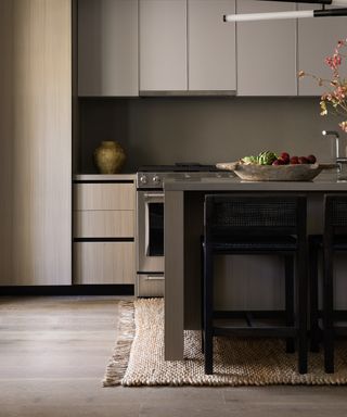 wooden kitchen with rug under island