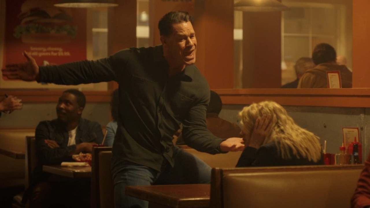 Christopher singing to Harcourt in a restaurant in Peacemaker Season 2 finale