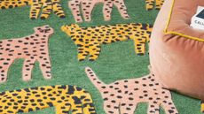 Fun cheetah design rug in green and assorted