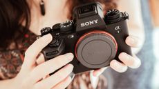 Sony A1 being held in the hand