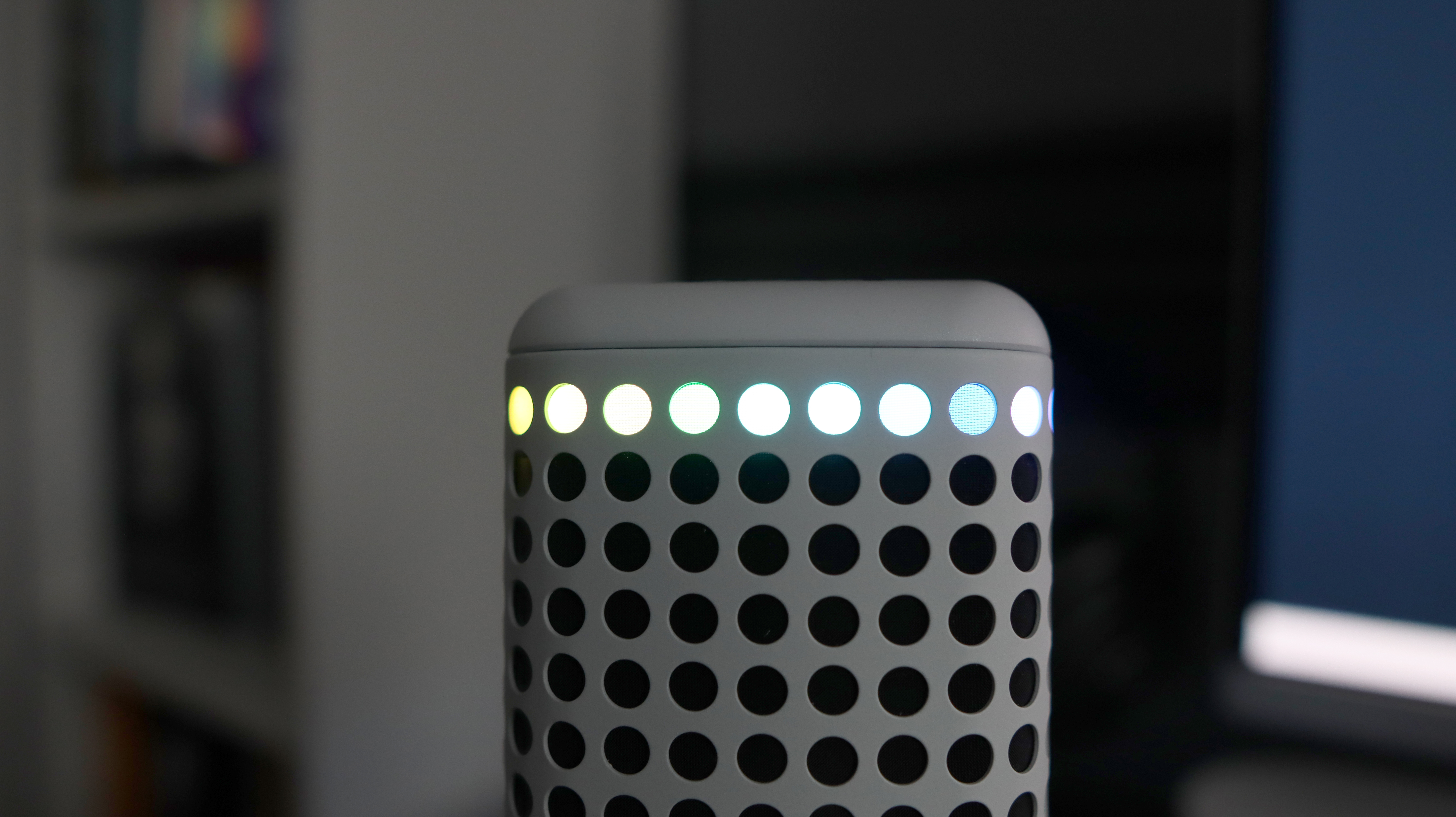 An NZXT Capsule Elite microphone set up on a desk with lighting enabled.