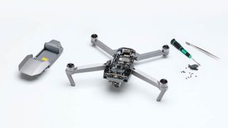 A DJI drone in the process of being repaired