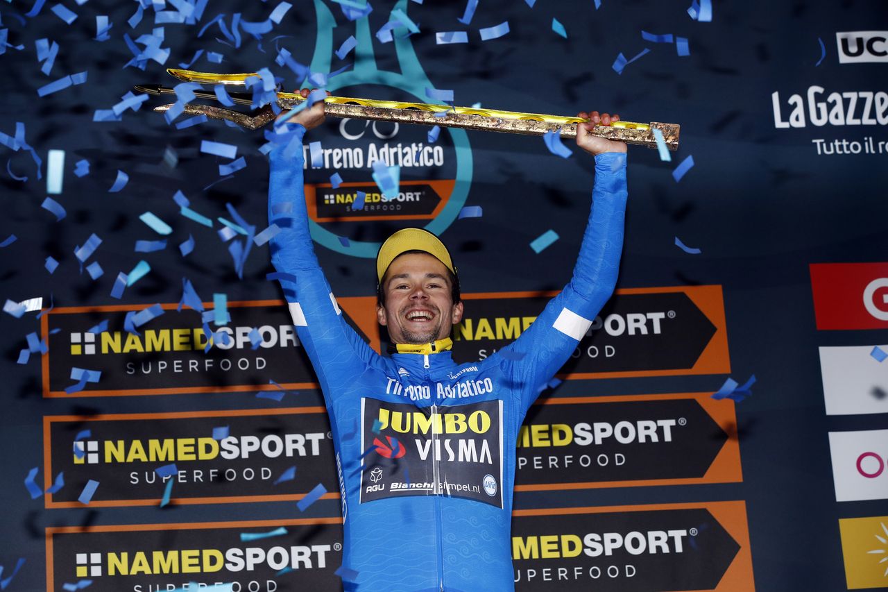 Primoz Roglic with the trident trophy