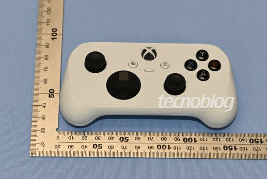 White Xbox cloud gaming controller prototype with compact rounded design shown beside measuring rulers