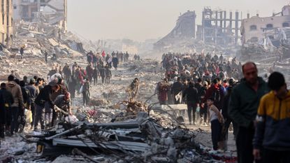 Displaced Palestinians walk along a road in Gaza City on Jan. 19, 2025.