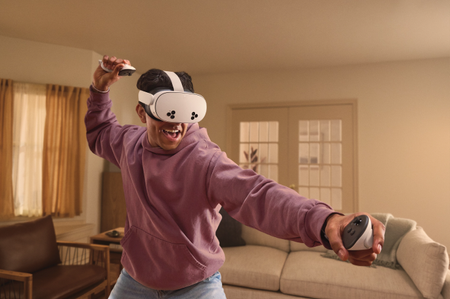 Man wearing a Meta Quest headset with arms out 