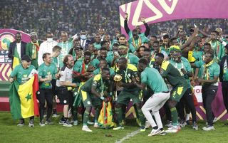 Senegal players and staff celebrate winning the last AFCON