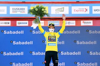 BILBAO SPAIN APRIL 05 Podium Primoz Roglic of Slovenia and Team Jumbo Visma Yellow Leader Jersey Celebration during the 60th ItzuliaVuelta Ciclista Pais Vasco 2021 Stage 1 a 139km individual time trial from Bilbao to Bilbao Mask Covid safety measures Trophy Flowers itzulia ehitzulia ITT on April 05 2021 in Bilbao Spain Photo by David RamosGetty Images