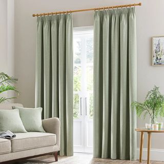Dunelm Luna Brushed Blackout Pencil Pleat Curtains in a living room