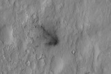 This image shows the crash site of the Mars rover Curiosity's sky crane, the rocket-powered backpack that lowered Curiosity down to the Martian surface on Aug. 5 PDT, 2012. Image released Aug. 7.