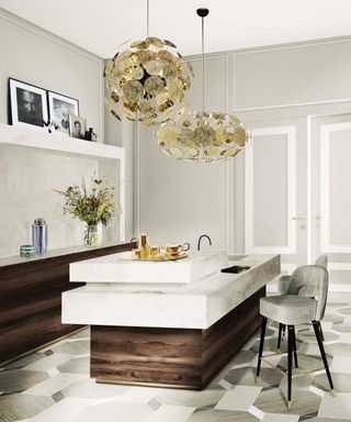 split level kitchen island with marble tiered sections on top and dark wood base