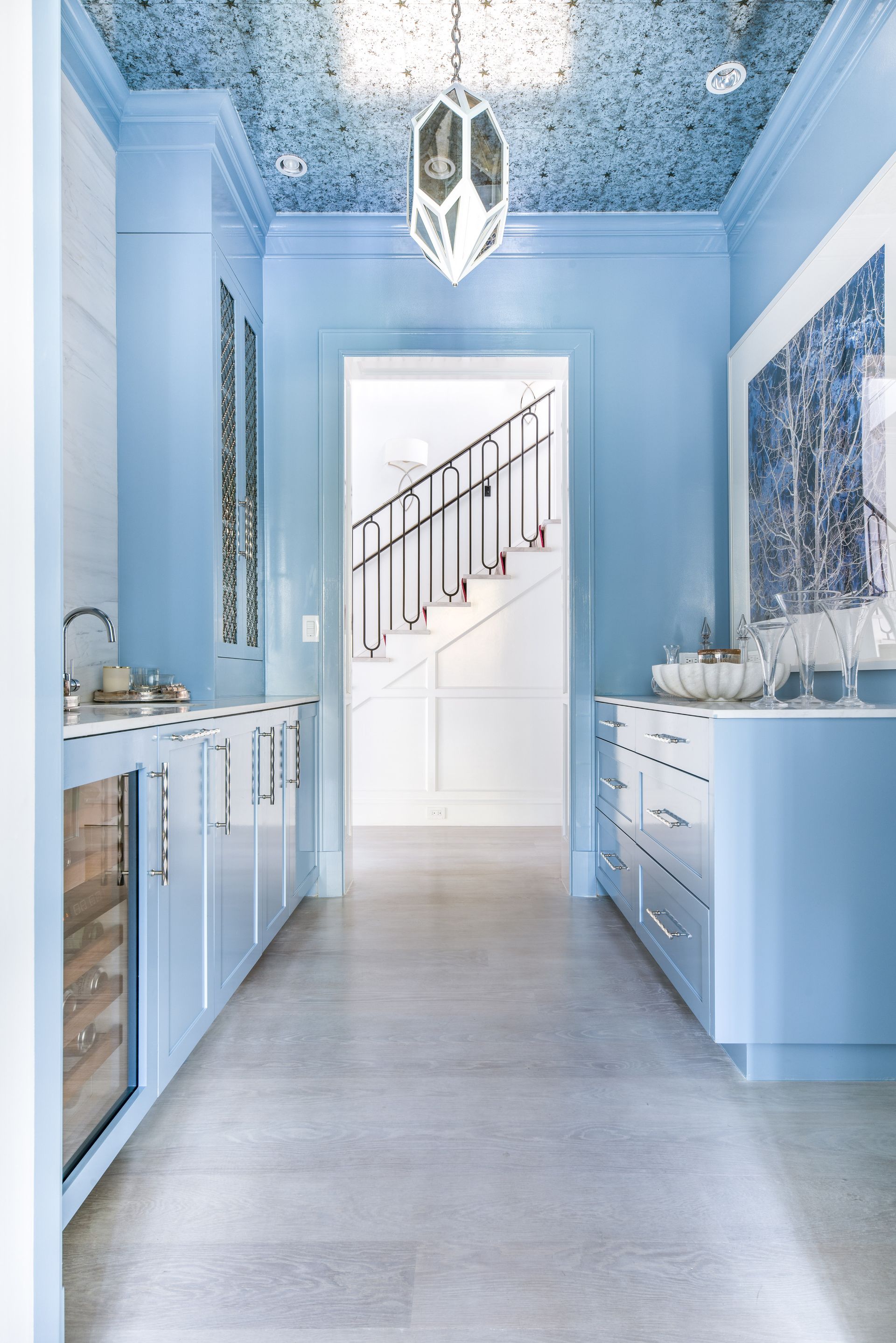 A kitchen bathed in blue