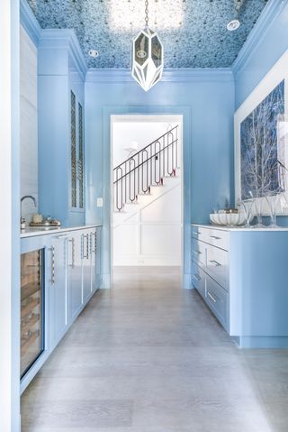 A kitchen bathed in blue