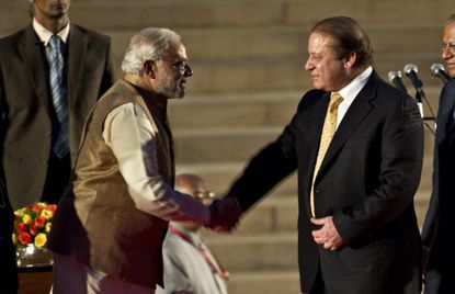 Newly sworn-in Indian Prime Minister Narendra Modi meets with Pakistani counterpart