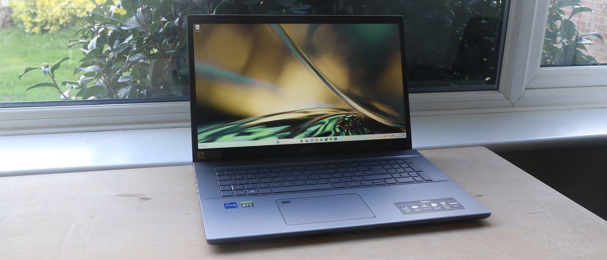 Acer Aspire 5 laptop on a wooden surface