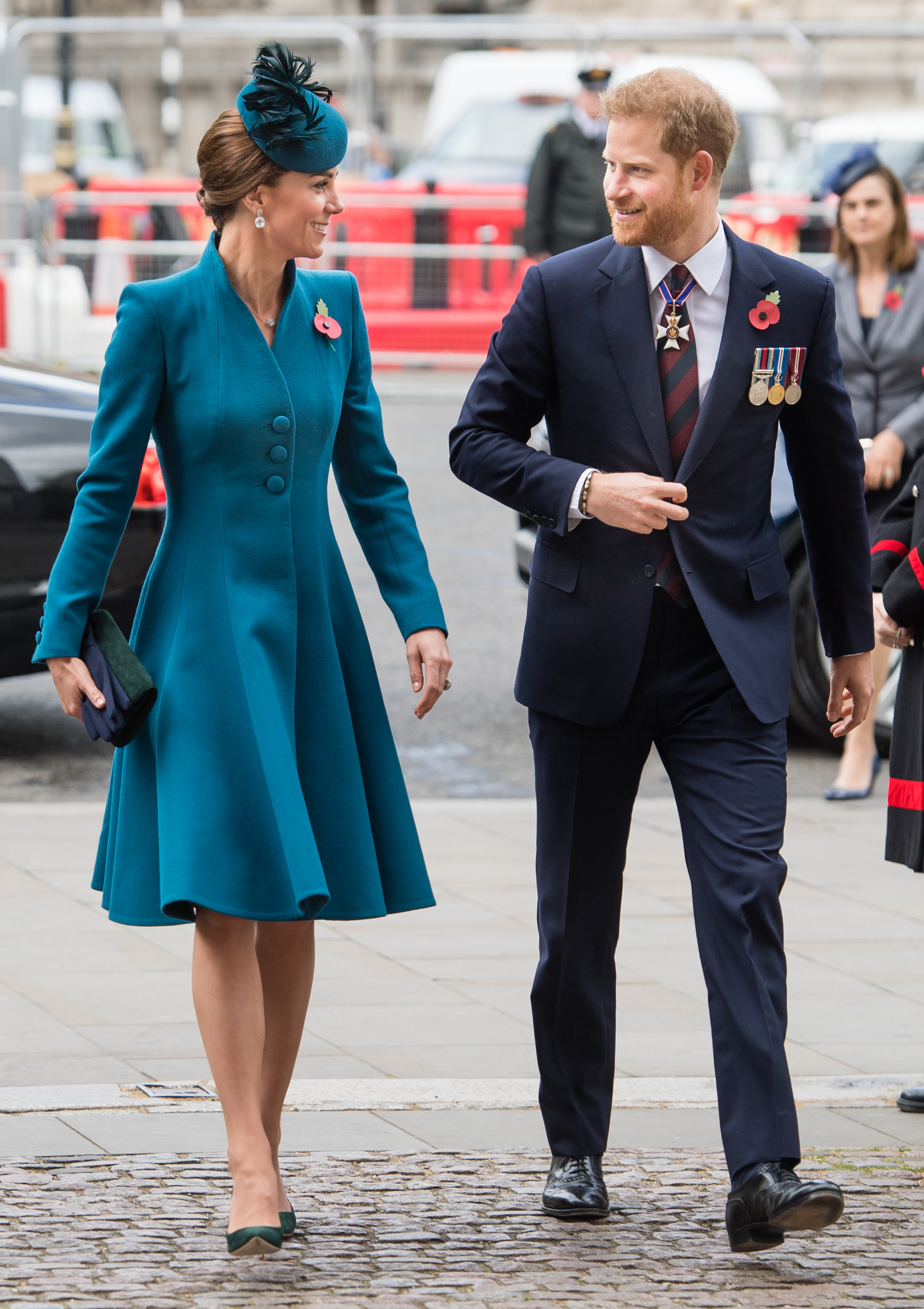 Prince Harry and Princess Kate walking into Westminster Abbey and smiling