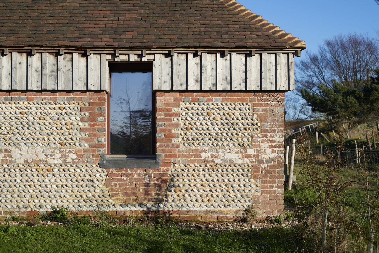 The original flint walls of this energy-efficient barn conversion have been restored