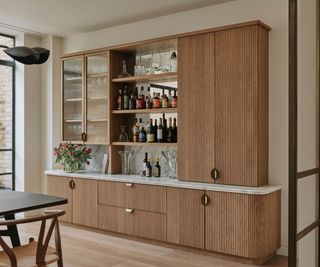 Fluted wooden kitchen cabinetry