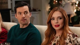 Lovebirds get a second chance in Our Little Secret as Lindsay Lohan and Ian Harding sit together on a couch.