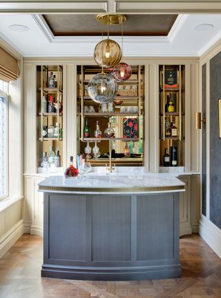 Home bar with large kitchen island painted blue