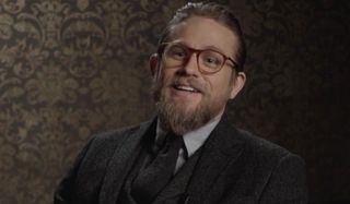 The Gentlemen Charlie Hunnam talking on camera in his suit