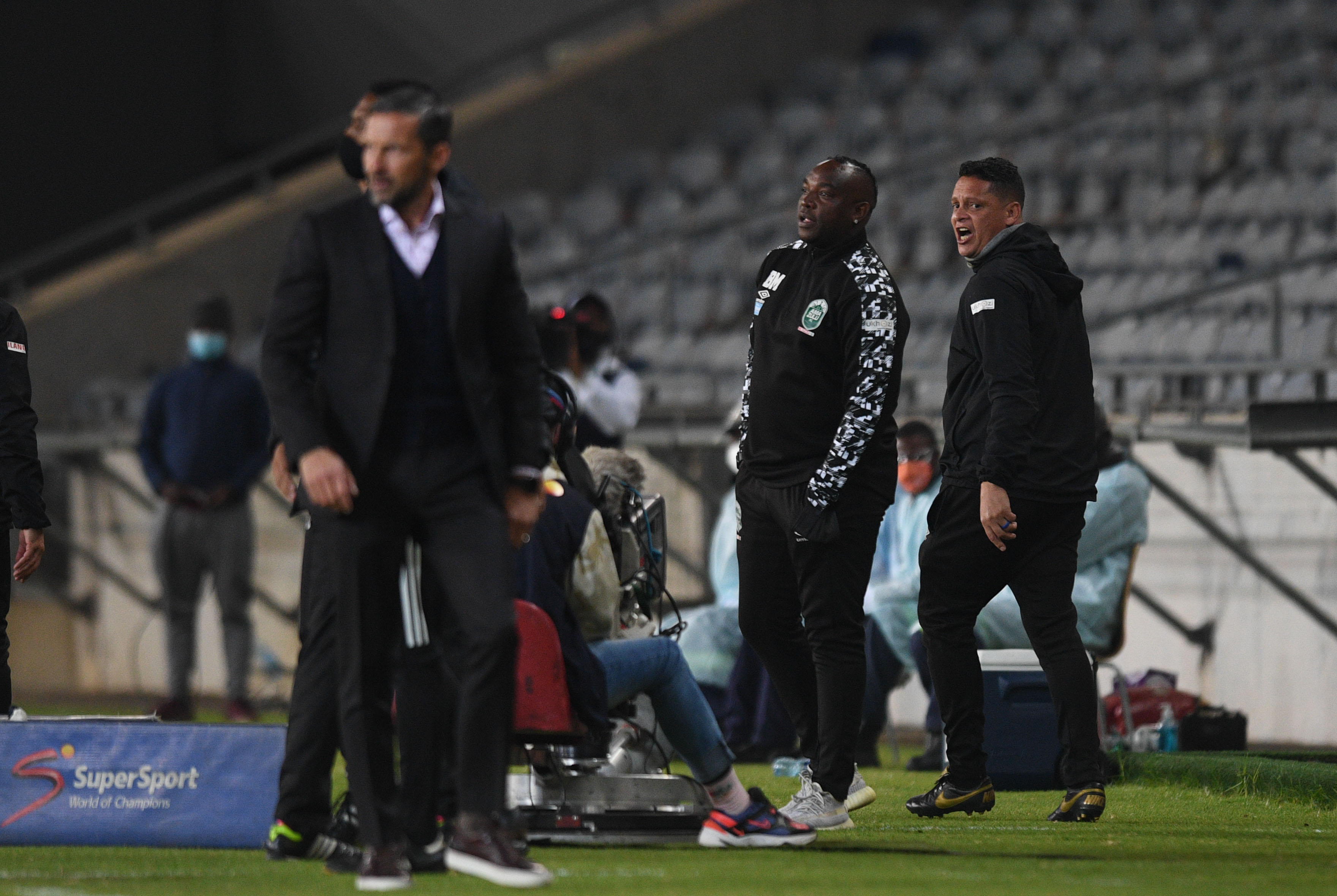 Josef Zinnbauer in a brawl with Benni McCarthy and Moeneeb Josephs