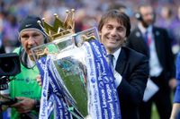 Chelsea manager Antonio Conte holds the Premier League trophy, 2017