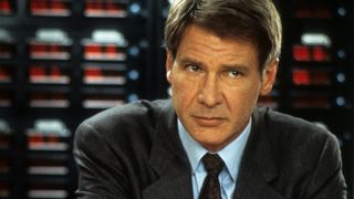 Harrison Ford stands in front of a computer in A Clear and Present Danger