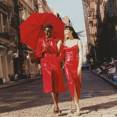 two models wearing two looks from j.crew x christopher john rogers collaboration on the street in soho