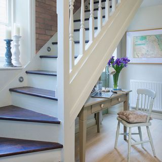 hallway with staircase and wooden table
