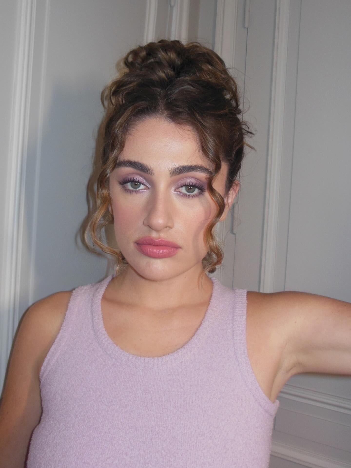 Rachel Anne Sennott with twisted topknot - curly hairstyles