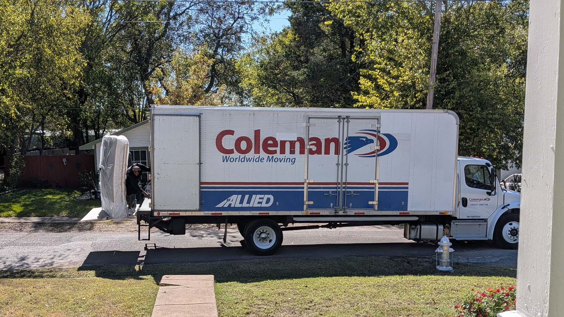 Saatva Latex Hybrid mattress being unloaded from a delivery truck