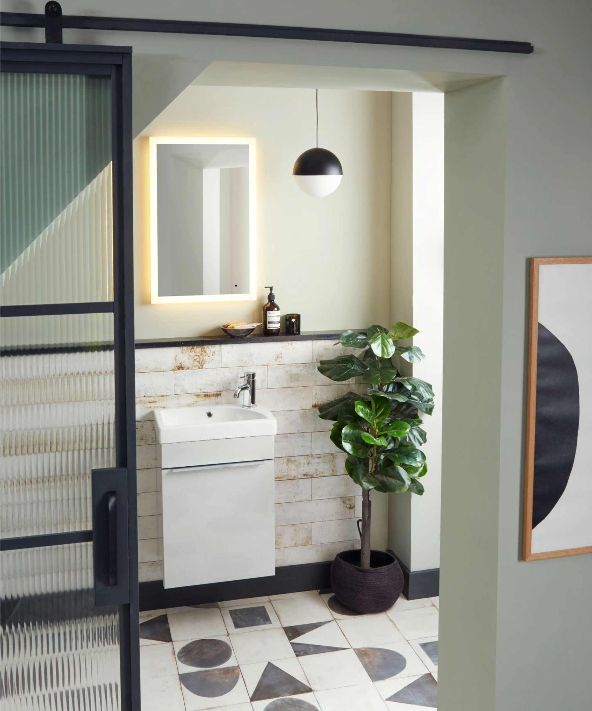 Bathroom with sink and sliding doors