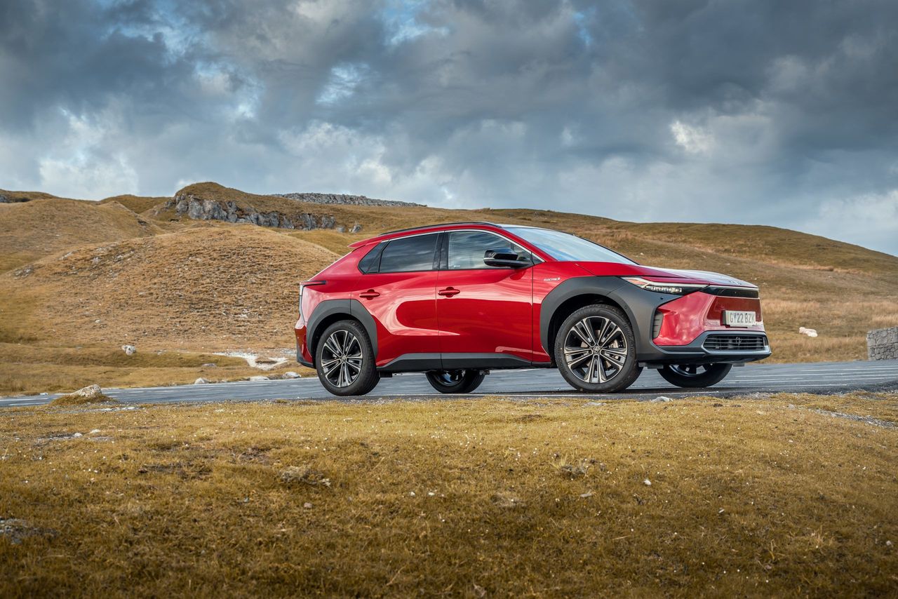 Toyota bz4X in rugged terrain with moody sky