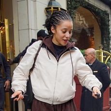 Chase Infiniti wearing a brown sweatsuit, beige jacket, and tan Ugg boots 