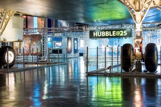 The Hubble Space Telescope takes center stage in the Hubble@25 exhibit at New York City's Intrepid Sea, Air and Space Museum. The Hubble Telescope will celebrate its 25th anniversary in April 2015.